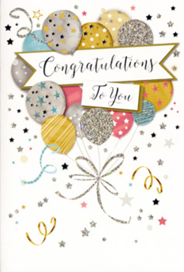 In this detailed view of a congratulations card, the design captures the buoyant spirit of a Northolt celebration, like the moment balloons are released at the end of a party. The card features a central cluster of illustrated balloons that seem to hover lightly over the page, arranged so their rounded forms overlap and create a soft sense of depth. Their colour palette is refined and modern: warm gold and antique champagne sit beside cool silver, misty grey, sky blue, and gentle blush pink, each balloon highlighted with a faint sheen that suggests a glossy, almost pearlescent surface. Some are embellished with neat metallic stripes, others with scattered stars or full glitter-style finishes, giving the impression of varying textures under your fingertips. Slender gold and silver ribbons trail from their bases, curling and entwining like elegant streamers you might see decorating a family gathering near Northolt's community centres. Just below the main balloon cluster, a ribbon-like banner stretches across the width of the card, lightly shaded at the edges to appear as though it is lifting off the background. On this banner, the words Congratulations To You are written in stylish, flowing calligraphy, the ink a deep, confident tone that balances the soft pastel and metallic hues surrounding it. The background remains pale and uncluttered, gently sprinkled with tiny stars, dots, and looping flourishes that echo the shapes of confetti and party ribbons drifting on the breeze. There are no flowers in the illustration, yet as a florist I see the card as the perfect companion to a fresh bouquet delivered anywhere in Northolt, from quiet residential roads near the A40 to homes by Northala Fields, offering a sense of pride, joy, and timeless celebration.
