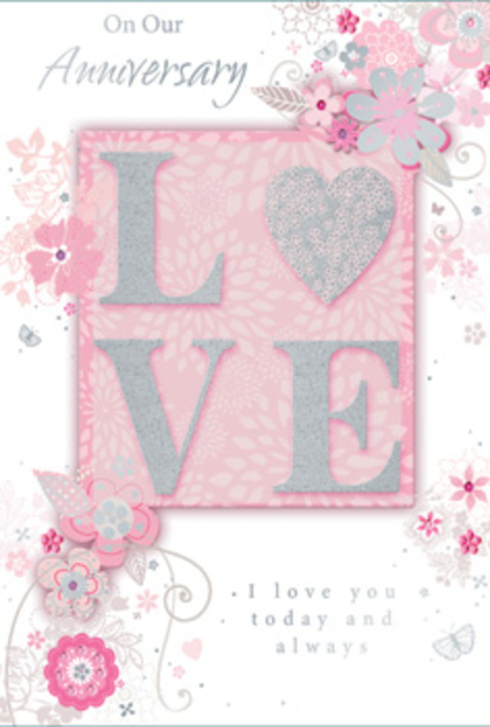 This elegant anniversary card looks as if a florist and an illustrator collaborated to capture the essence of a romantic bouquet for a couple in Northolt. At its heart, the word LOVE stands proudly in raised lettering, each letter filled with a delicate blush pink tone and kissed with a dusting of fine, frosty glitter. The glitter seems to sit lightly on the surface, catching the light like dew on pale rose petals, and creating a subtle, tactile texture under the fingertips. Surrounding this central motif, the background is a soft wash of rosy pink that gradually softens toward the edges, creating a dreamy halo around the word. Flowing across this gentle ground is a cascade of stylised blooms and leafy sprays rendered in a palette of blush, ivory, silver-grey, and the faintest hints of lilac. The flowers are drawn with fine, curling lines, suggesting open blossoms, gently unfurling buds, and airy foliage that mirrors the look of a hand-tied arrangement you might see delivered along Church Road or toward Northolt's leafy lanes. Between the petals, slender vines twist and loop in decorative swirls, with tiny flourishes and almost-hidden butterflies adding a whisper of movement and quiet joy. Some elements glimmer with silver foil highlights, giving the card a sophisticated shimmer whenever it tilts in the light. An understated yet heartfelt message in flowing script expresses enduring love and gratitude, the kind of sentiment shared at milestone anniversaries celebrated in cosy Northolt living rooms. The overall mood is tender and timeless, like a soft-spoken promise, making this card feel as considered and personal as an artfully arranged bouquet brought to the door by a local Northolt florist.